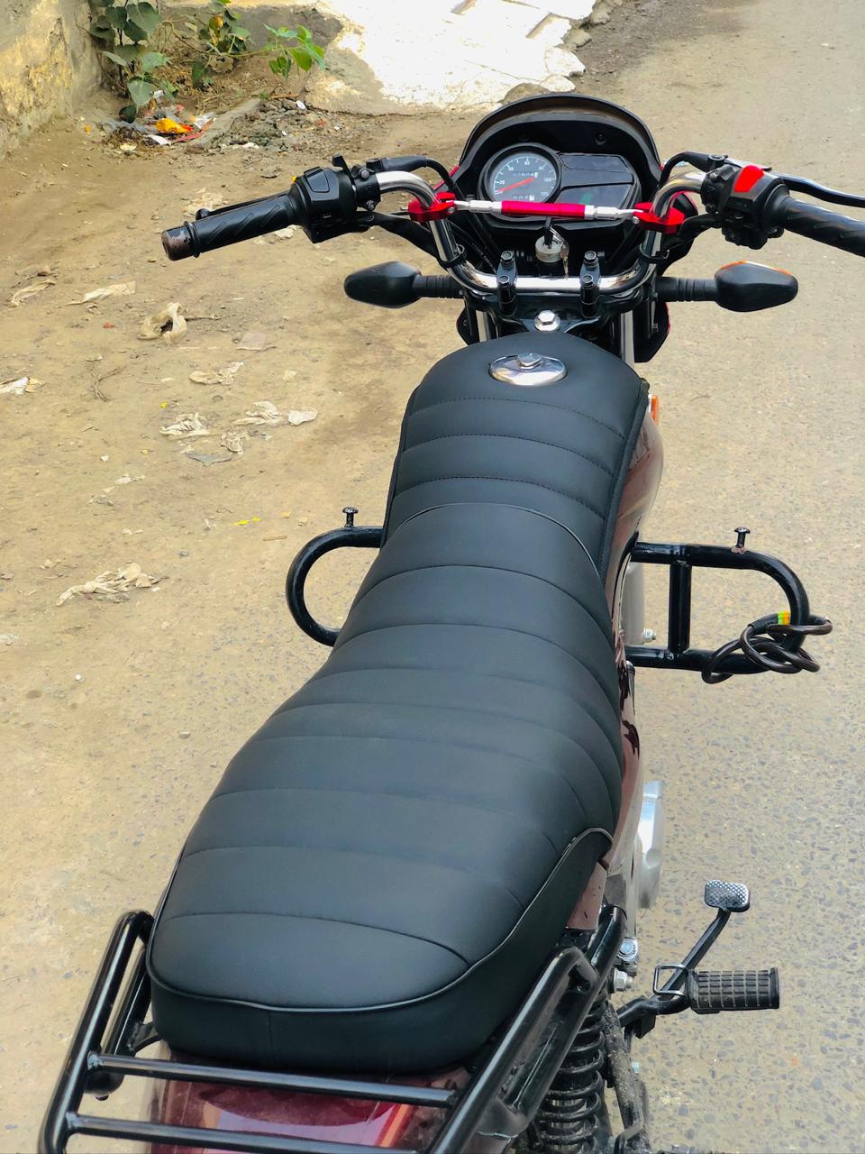 Motorcycle seat on a road with a blurred background